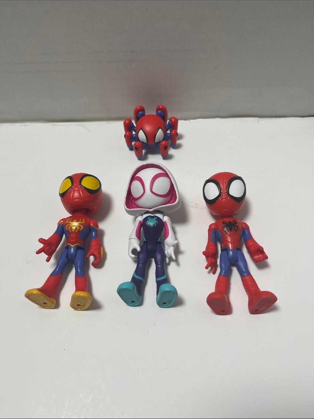 Marvel Spider-Man Figure Set of Four- Red, Blue, Purple, White, Yellow, Teal